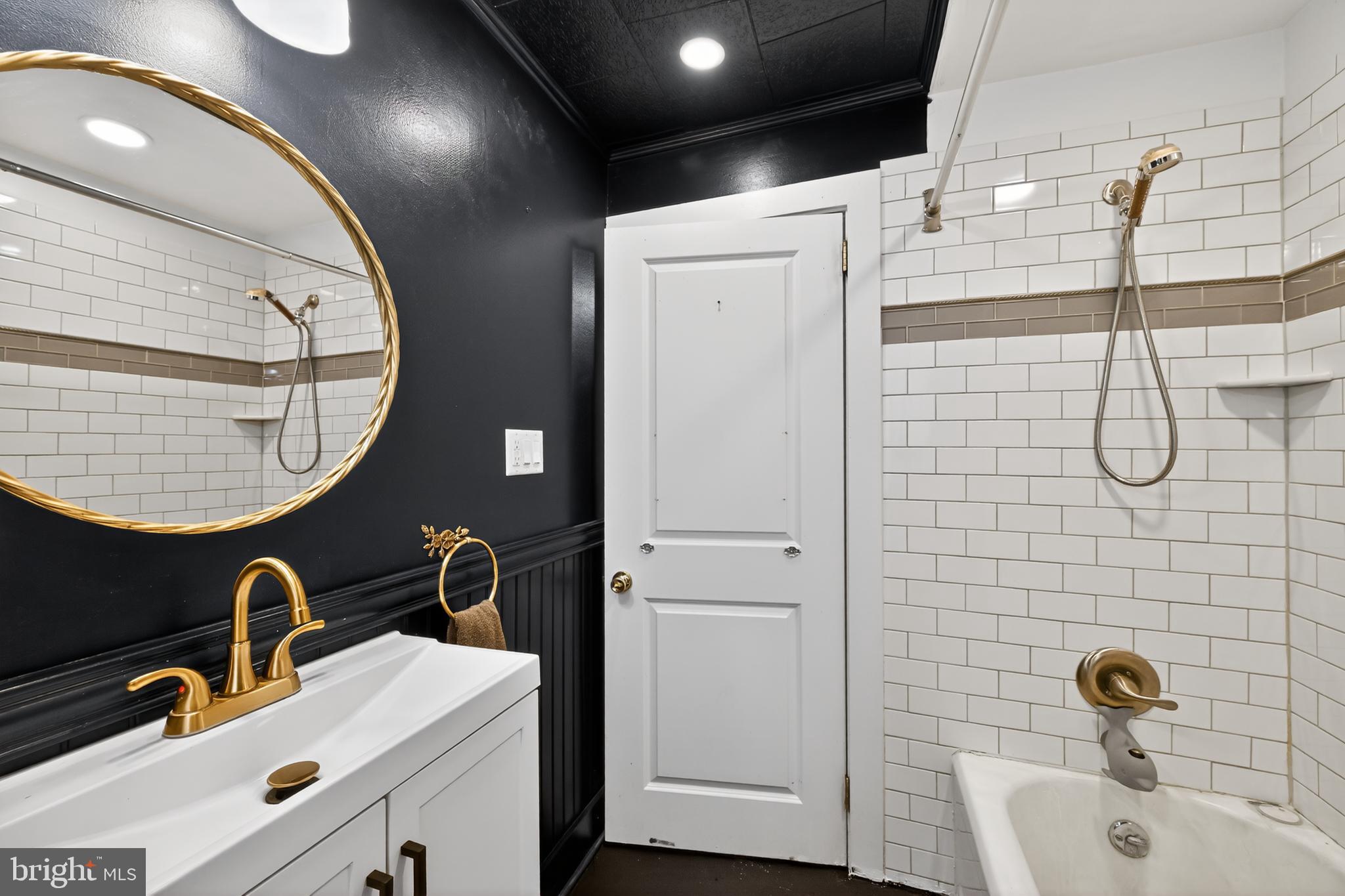 108 South Pearl Street Lancaster, PA 17603 - Photo 21 of 30 a bathroom with a sink and a mirror