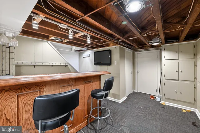 a white toilet sitting next to a bathroom sink