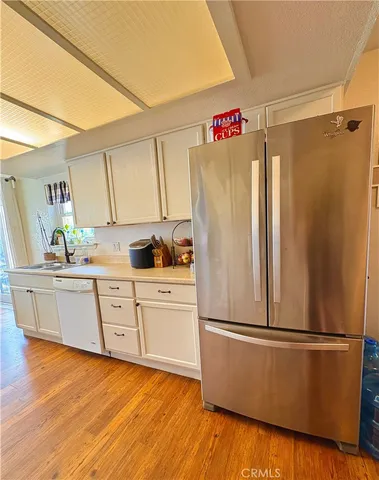 a white refrigerator freezer sitting in a kitchen