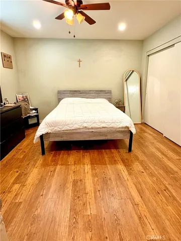 a bed sitting in a room next to a window