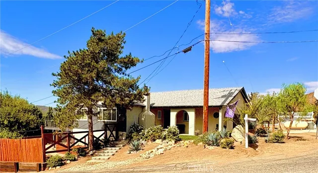 a front view of a building with sitting area
