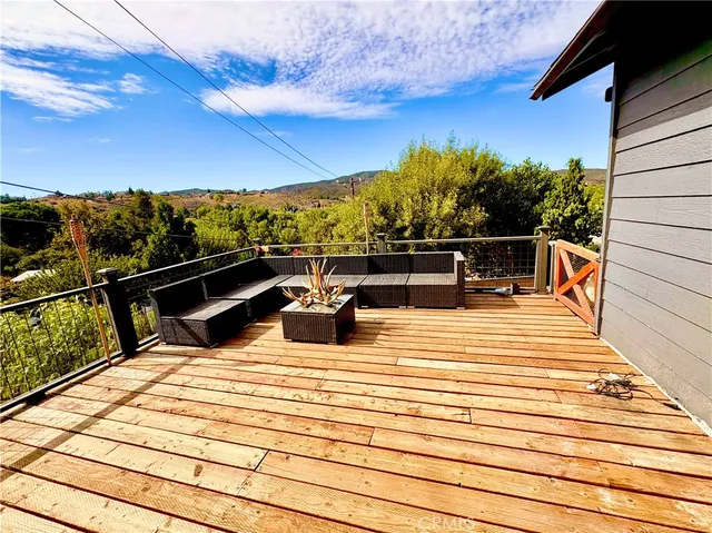a view of roof deck with seating space