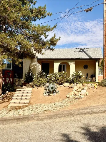 a view of a house with snow on the side of a building