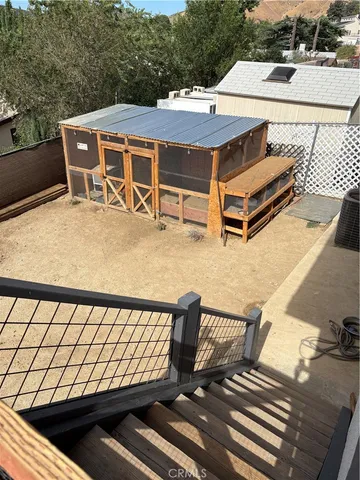 a roof deck with a table and chairs