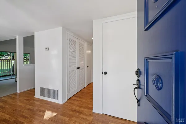 a view of a kitchen with an empty space and a window