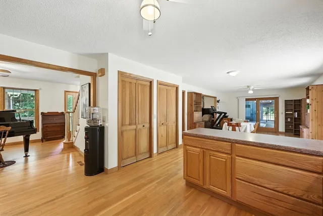 a kitchen with stainless steel appliances granite countertop a stove and cabinets