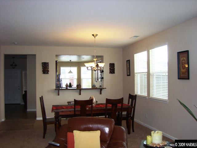 521 Needles Court Reno, NV 89521 - Photo 6 of 9 a view of a a dining room with furniture window and wooden floor