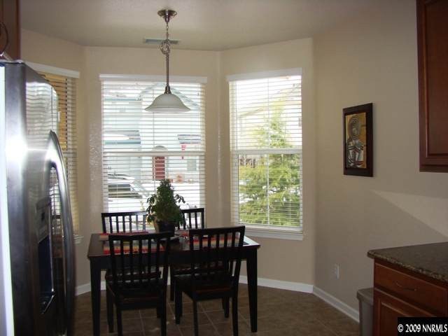 521 Needles Court Reno, NV 89521 - Photo 7 of 9 a view of a dining room with furniture window and outside view