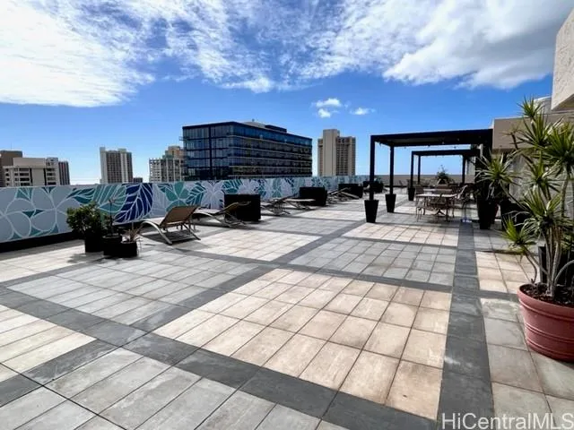 a view of a patio with a dining table and chairs