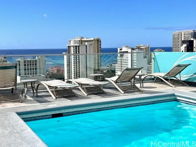 a view of a swimming pool with chairs