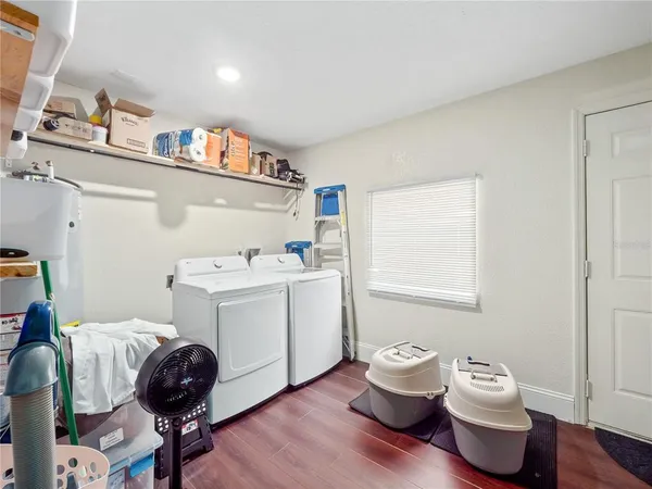 a bedroom with a workspace