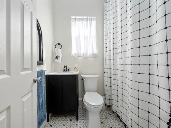a bathroom with a toilet and a sink