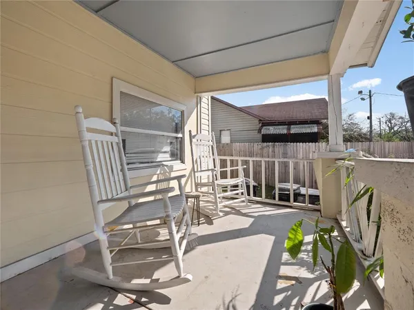 a view of a chairs and table in patio