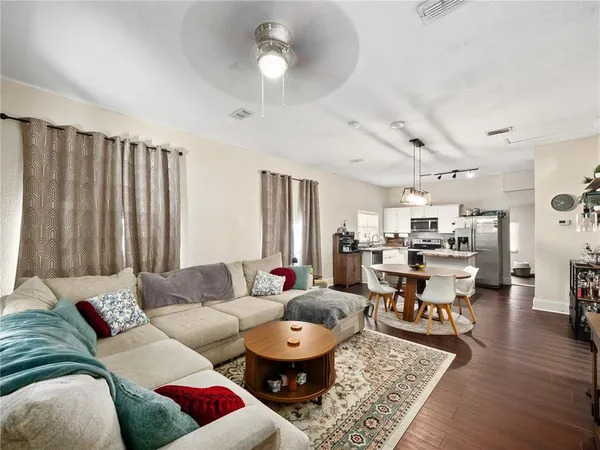 a living room with furniture and a rug