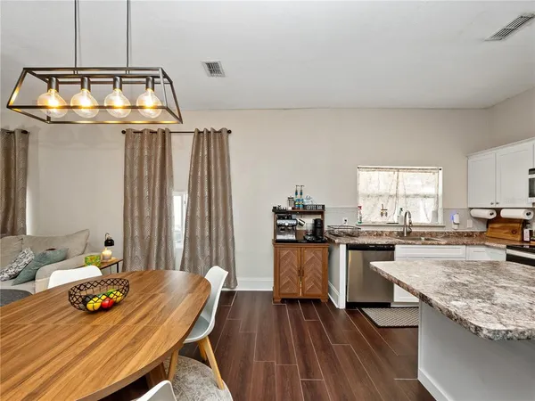 a kitchen with sink and stove