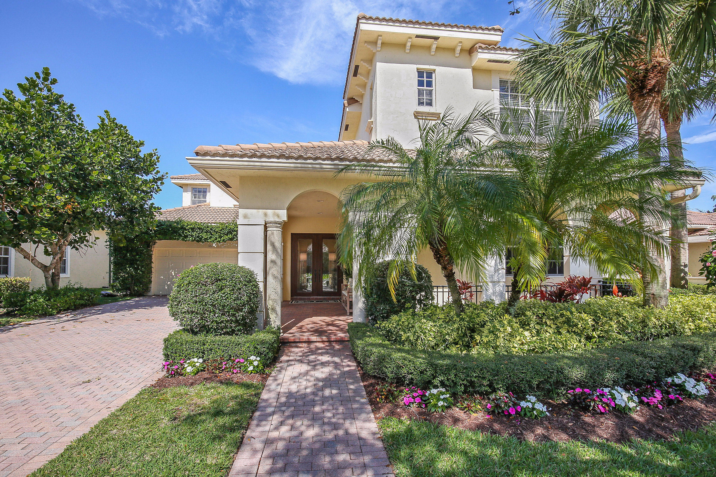 182 Via Veracruz Jupiter, FL 33458 - Photo 1 of 23 a front view of a house with plants and garden