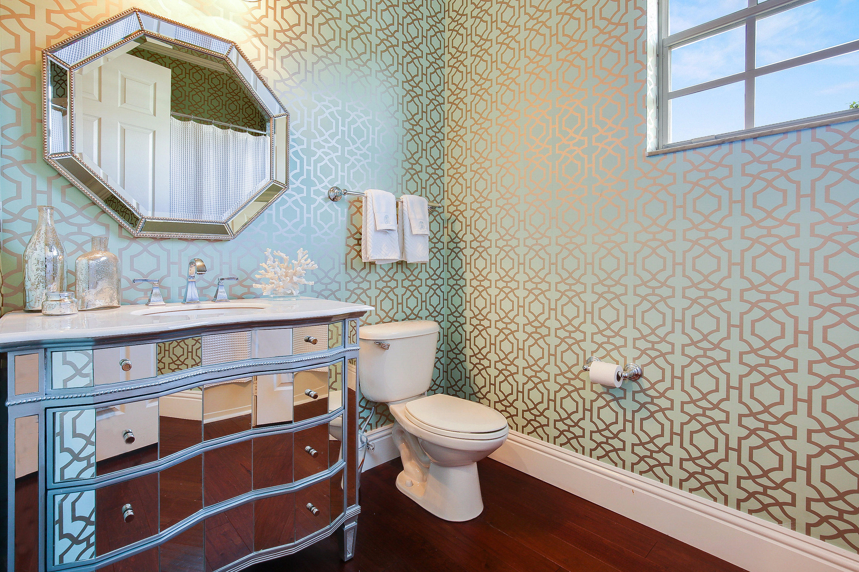 182 Via Veracruz Jupiter, FL 33458 - Photo 14 of 23 a bathroom with a toilet a sink and mirror