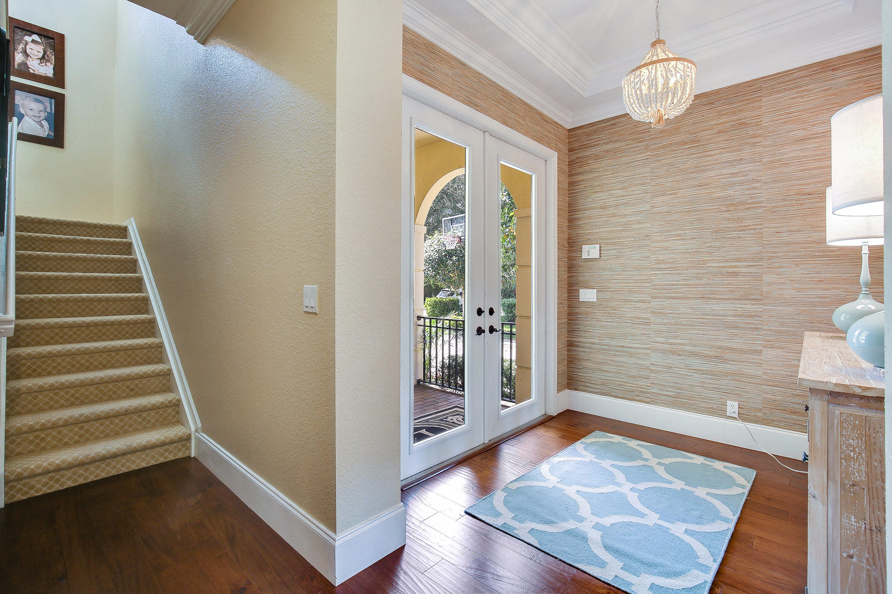 182 Via Veracruz Jupiter, FL 33458 - Photo 3 of 23 a view of an entryway with wooden floor