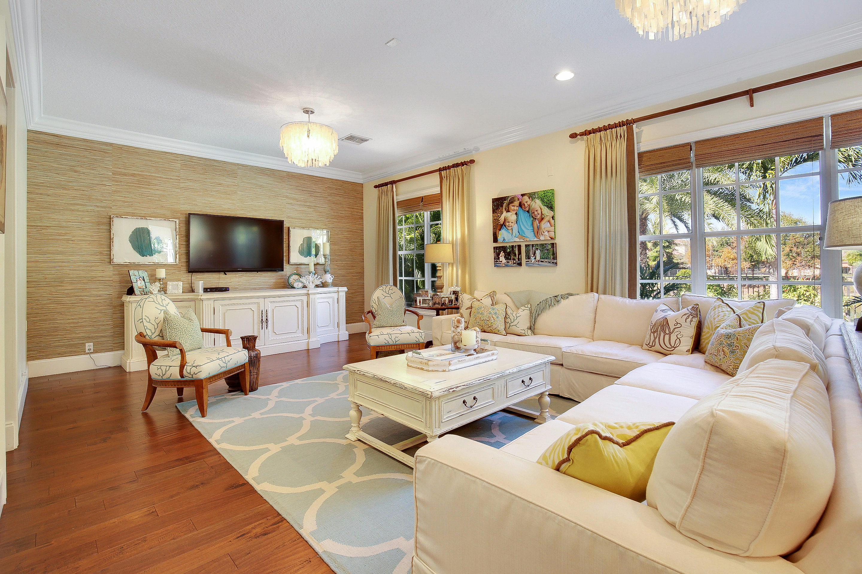 182 Via Veracruz Jupiter, FL 33458 - Photo 4 of 23 a living room with furniture wooden floor and a flat screen tv