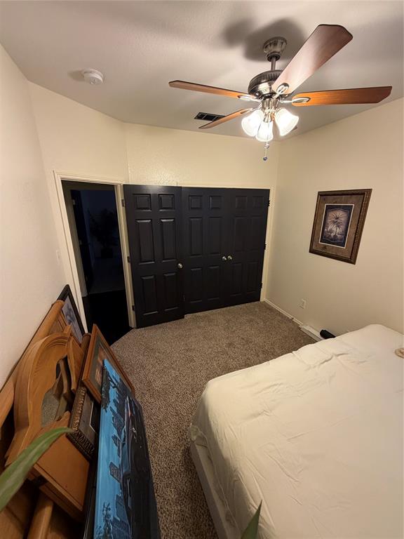 2531 Quail Ridge Road Melissa, TX 75454 - Photo 3 of 29 a bedroom with a bed and cabinets