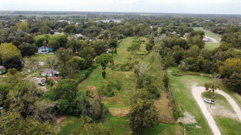 2725 North Walnut Street Wharton, TX 77488 - Photo 2 of 7 an aerial view of residential houses with outdoor space and trees