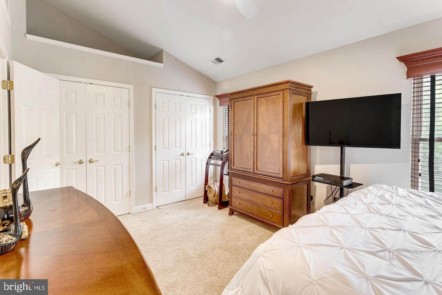 14220 Madrigal Drive Woodbridge, VA 22193 - Photo 13 of 30 a bedroom with a bed and a flat tv screen on the table