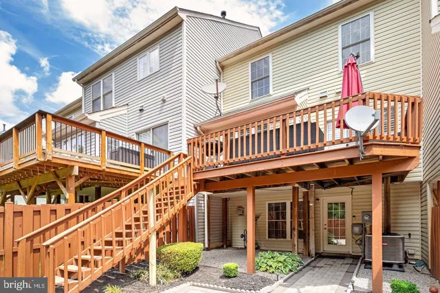 a view of a chair and wooden fence