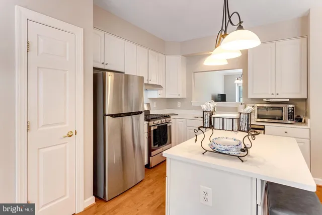 a living room with furniture a flat screen tv and a large window
