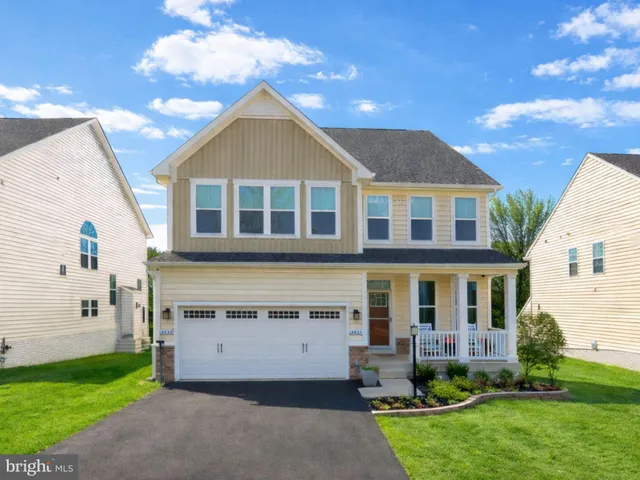 a view of house with yard