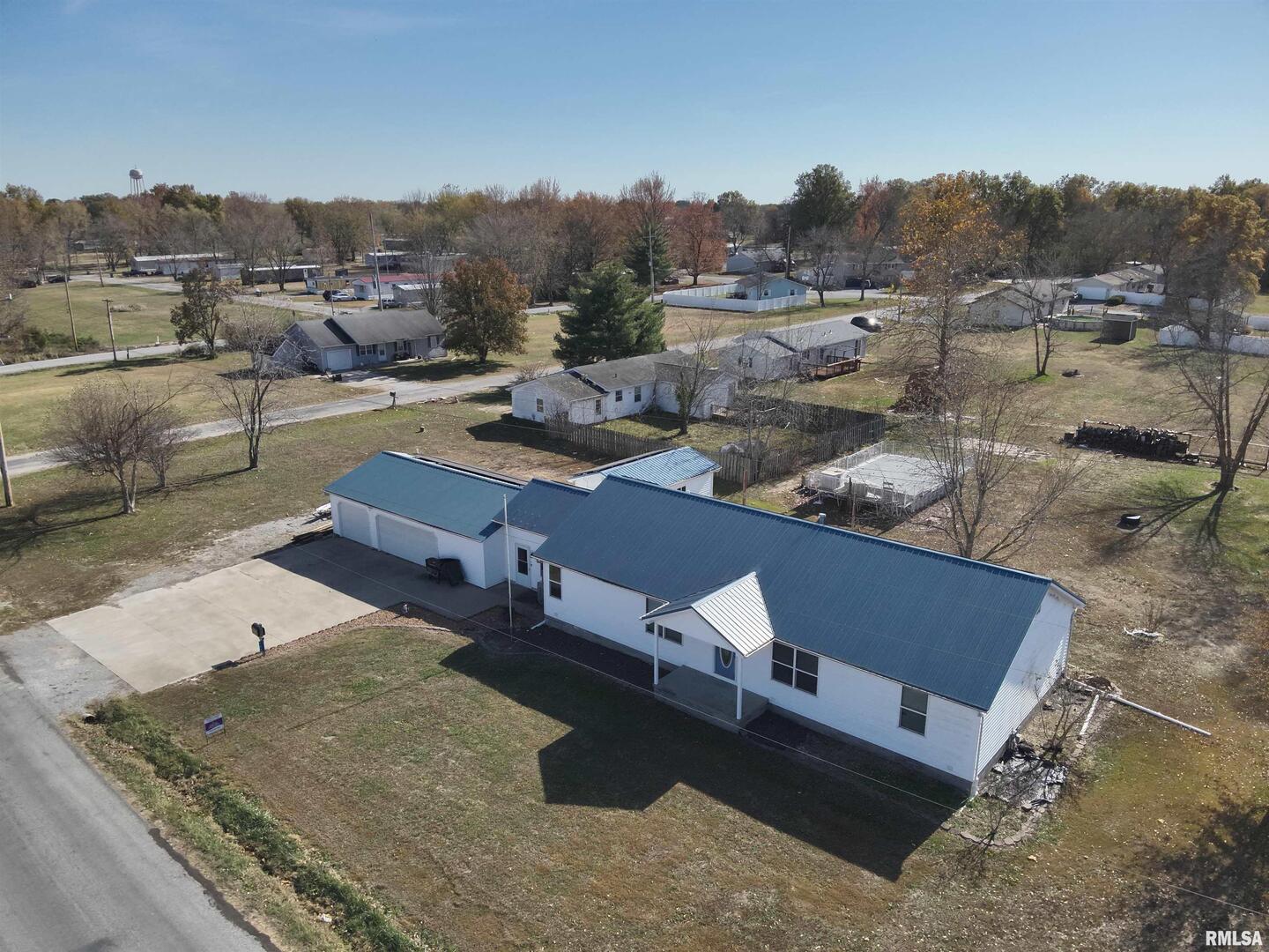 an aerial view of a house with a big yard