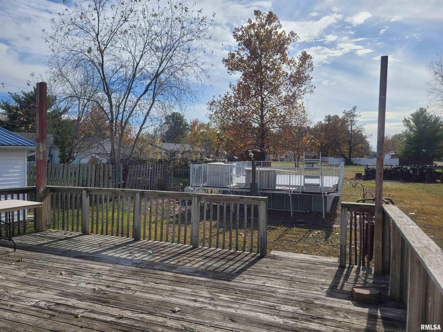 103 East Highline Road Woodlawn, IL 62898 - Photo 29 of 36 a view of a balcony with wooden floor and fence