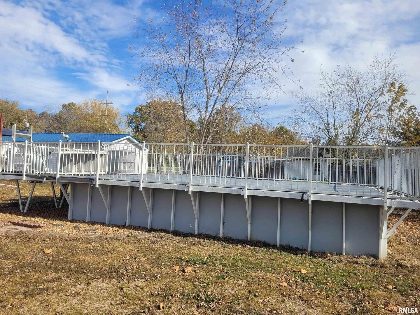 103 East Highline Road Woodlawn, IL 62898 - Photo 30 of 36 a view of a house with a wooden deck
