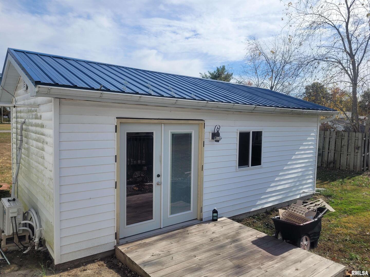 103 East Highline Road Woodlawn, IL 62898 - Photo 34 of 36 a view of a house with a backyard