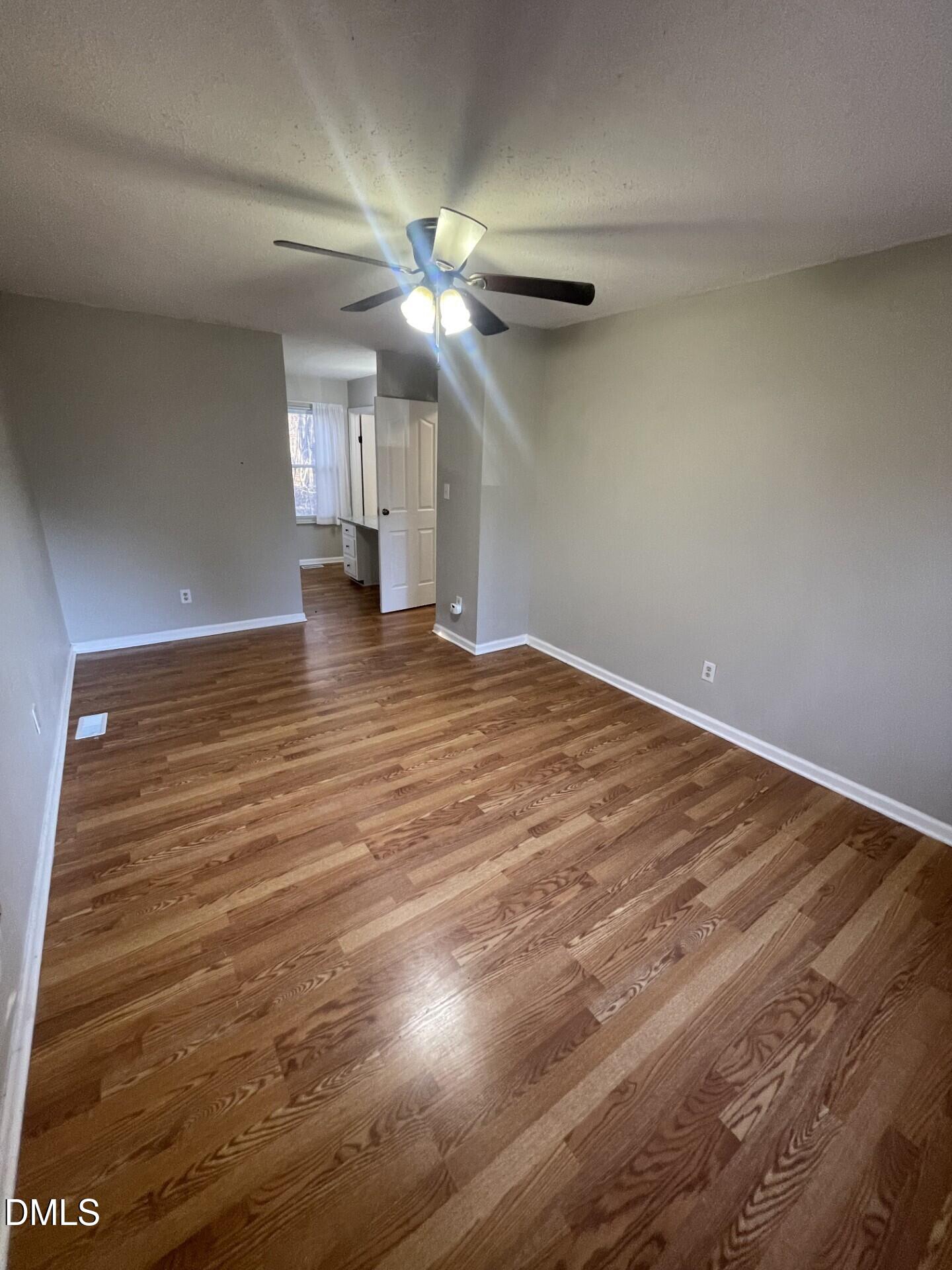 8920 Taymouth Court Raleigh, NC 27613 - Photo 15 of 20 a view of empty room with wooden floor