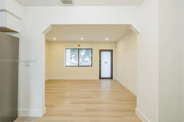 a view of an empty room and window