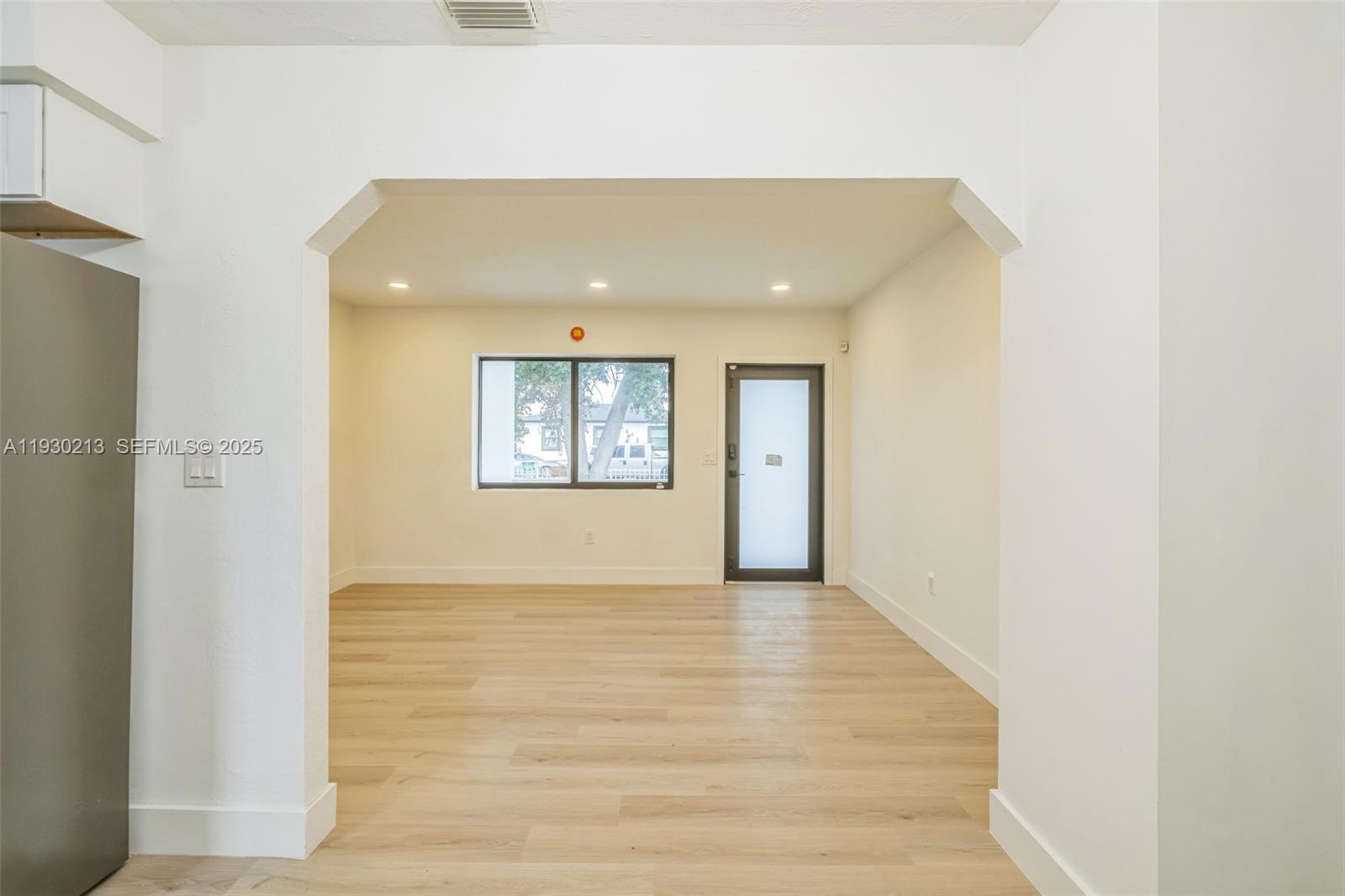 9055 Northwest 33rd Avenue Miami, FL 33147 - Photo 12 of 32 a view of an empty room and window