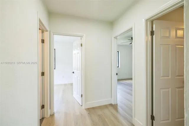 a view of a bathroom with a glass door shower