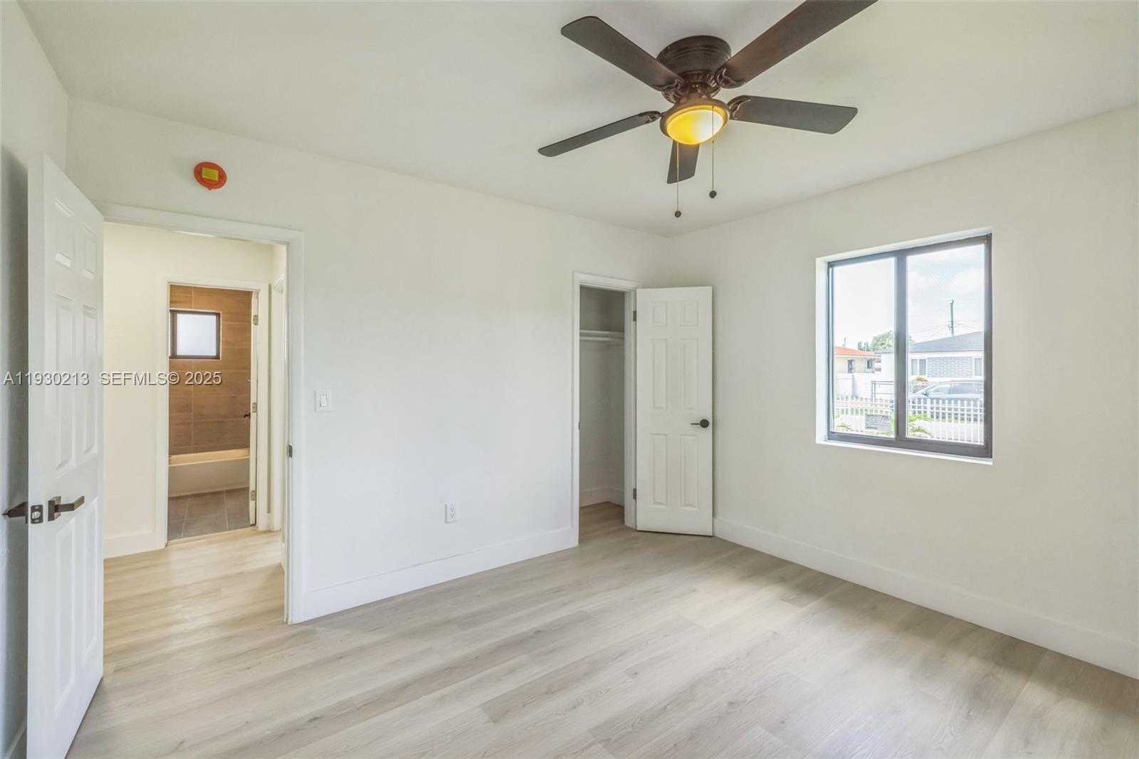 9055 Northwest 33rd Avenue Miami, FL 33147 - Photo 25 of 32 a view of an empty room with a window