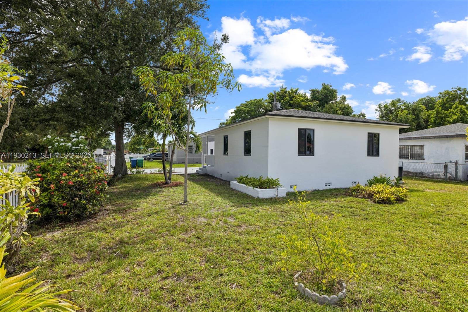 9055 Northwest 33rd Avenue Miami, FL 33147 - Photo 30 of 32 a view of backyard with a garden