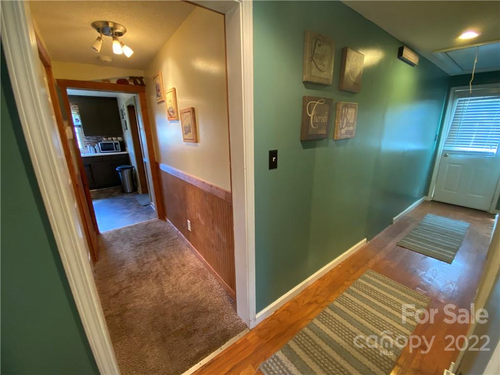 254 Landrum Road Tryon, NC 28782 - Photo 13 of 24 a view of hallway with stairs