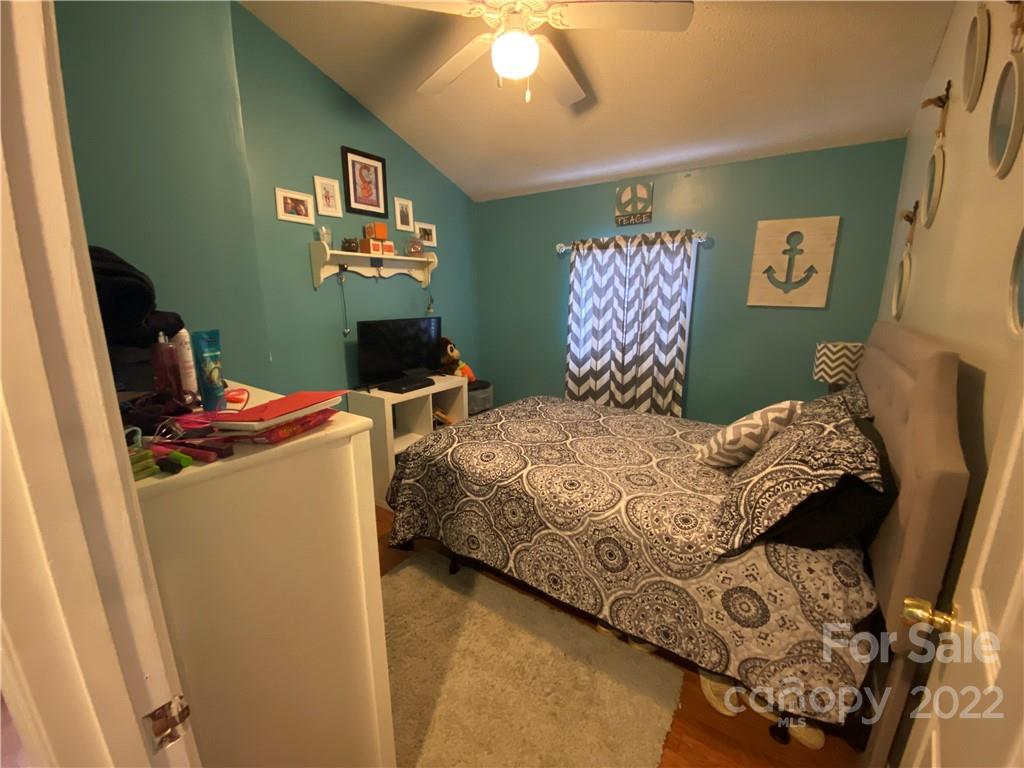 254 Landrum Road Tryon, NC 28782 - Photo 15 of 24 a bedroom with a bed and furniture