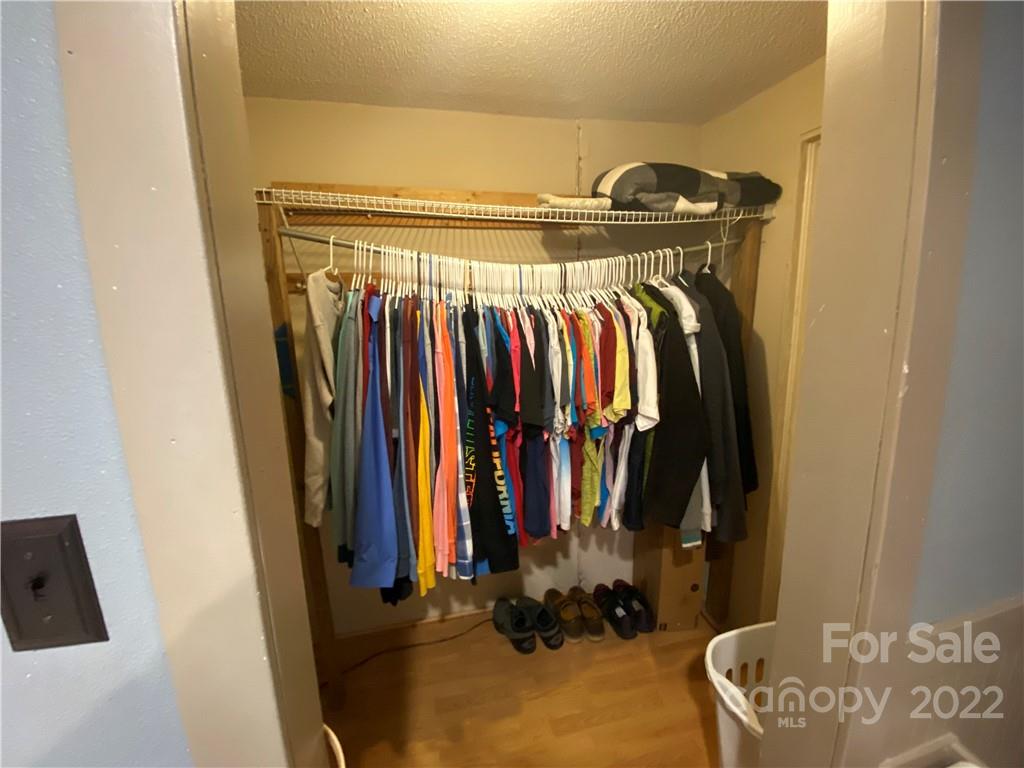254 Landrum Road Tryon, NC 28782 - Photo 22 of 24 a view of walk in closet with clothes