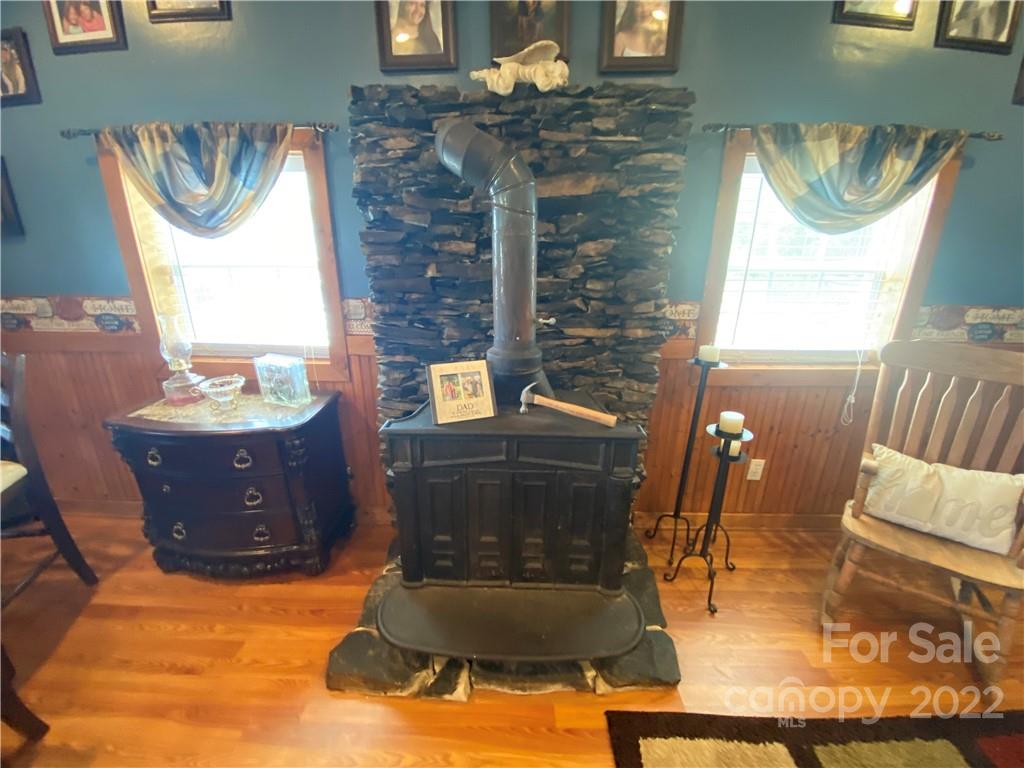 254 Landrum Road Tryon, NC 28782 - Photo 8 of 24 a living room with furniture and a fireplace