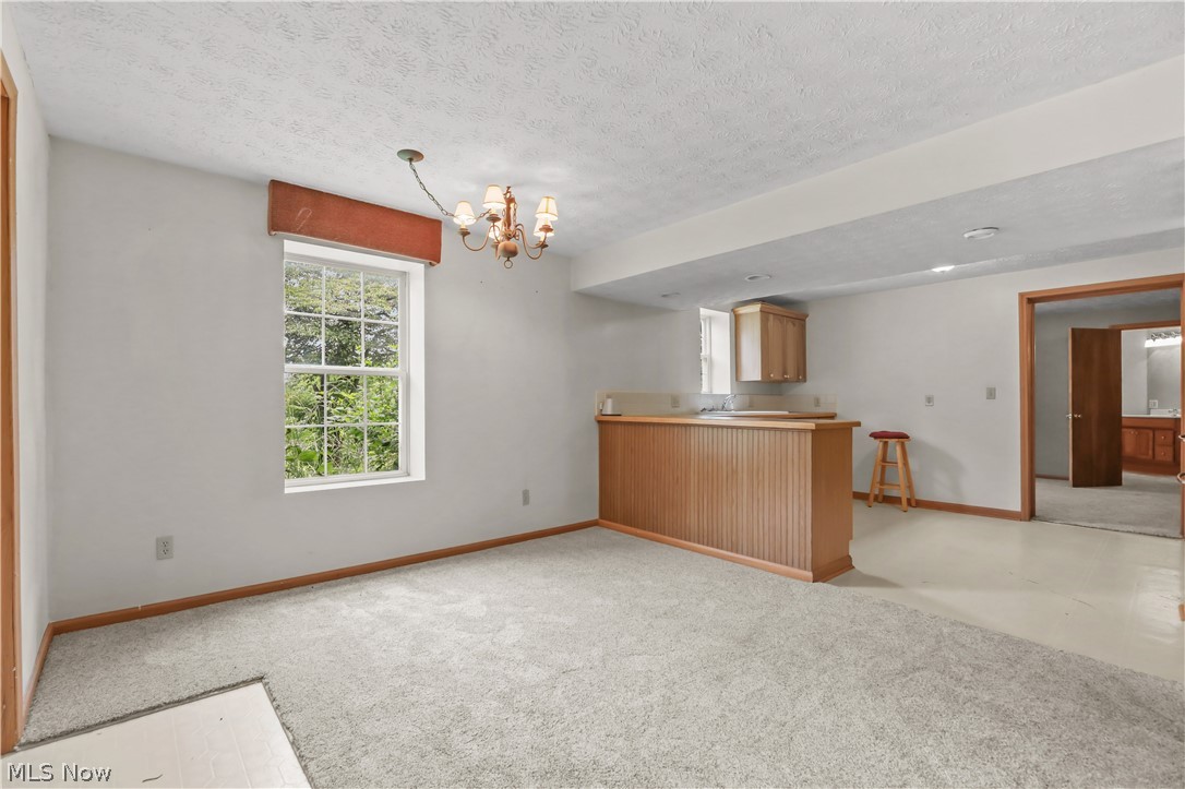 1701 Woods Road Akron, OH 44306 - Photo 32 of 43 Lower level living open to kitchen area