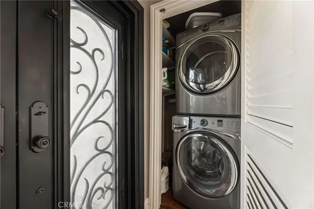 a kitchen with stainless steel appliances kitchen island granite countertop a refrigerator and cabinets