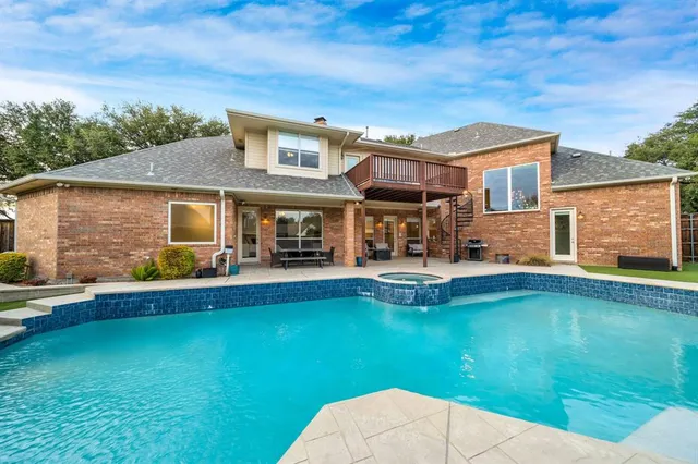 a view of house with swimming pool yard fire pit and outdoor seating