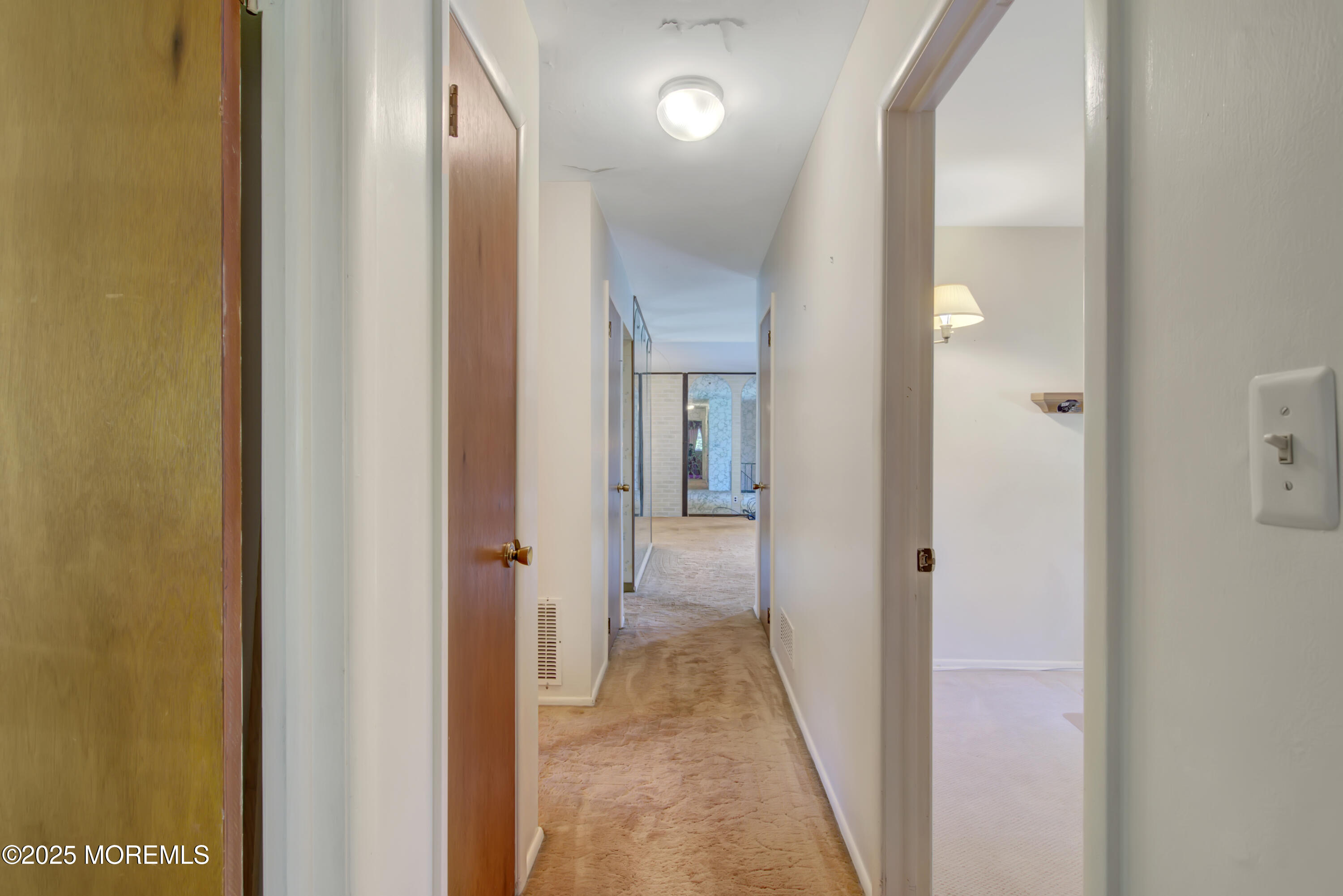 16 Burdge Drive Howell, NJ 07731 - Photo 20 of 30 a view of a bathroom from a corridor