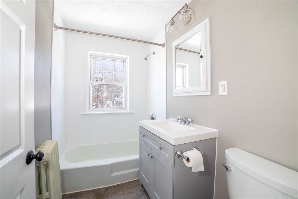 5 Maple Avenue, Unit 2 Oxford, MA 01537 - Photo 22 of 22 a bathroom with a sink a toilet and a bathtub