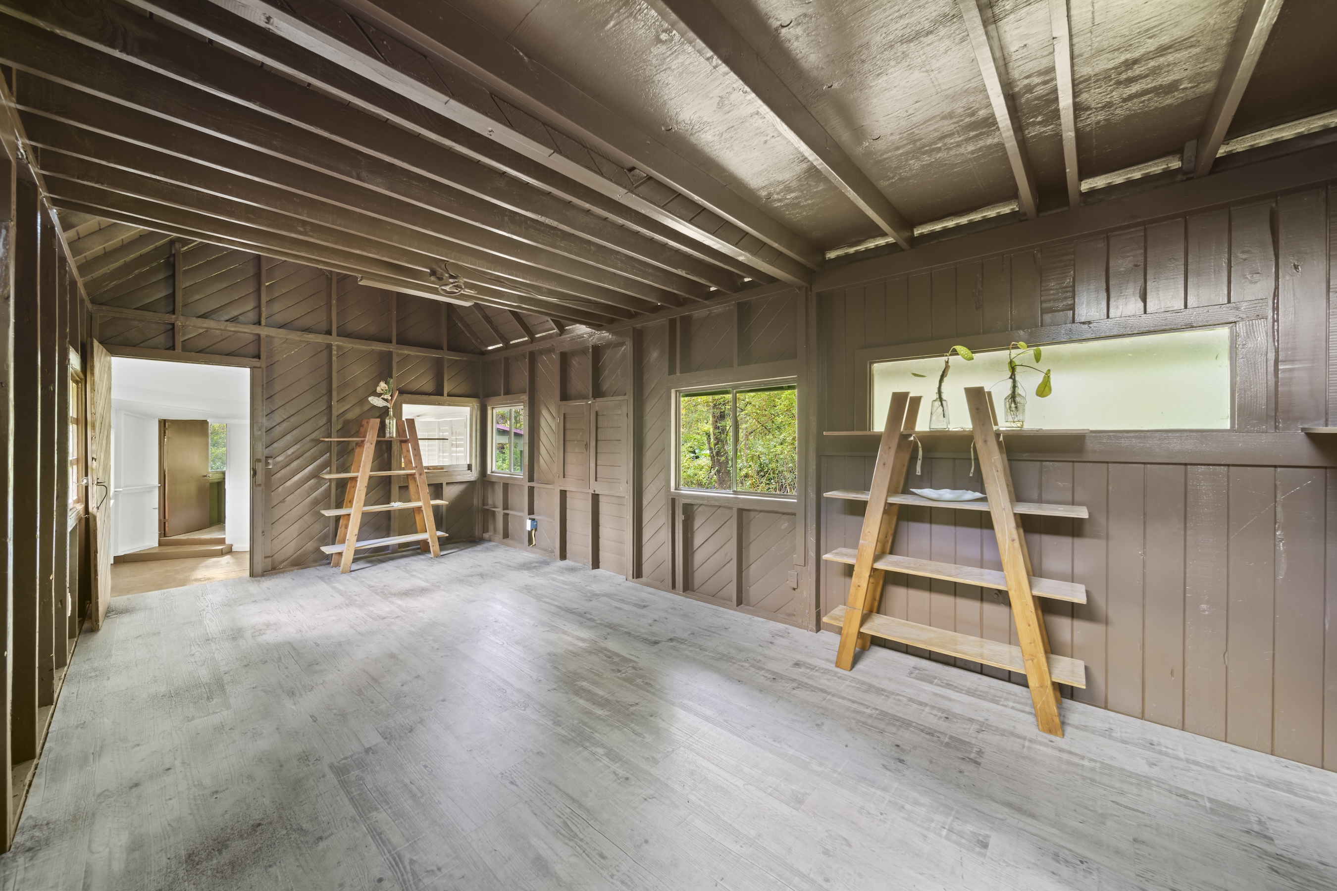 16-1857 Hopue Road Mountain View, HI 96771 - Photo 13 of 30 a view of an empty room with wooden floor and a window