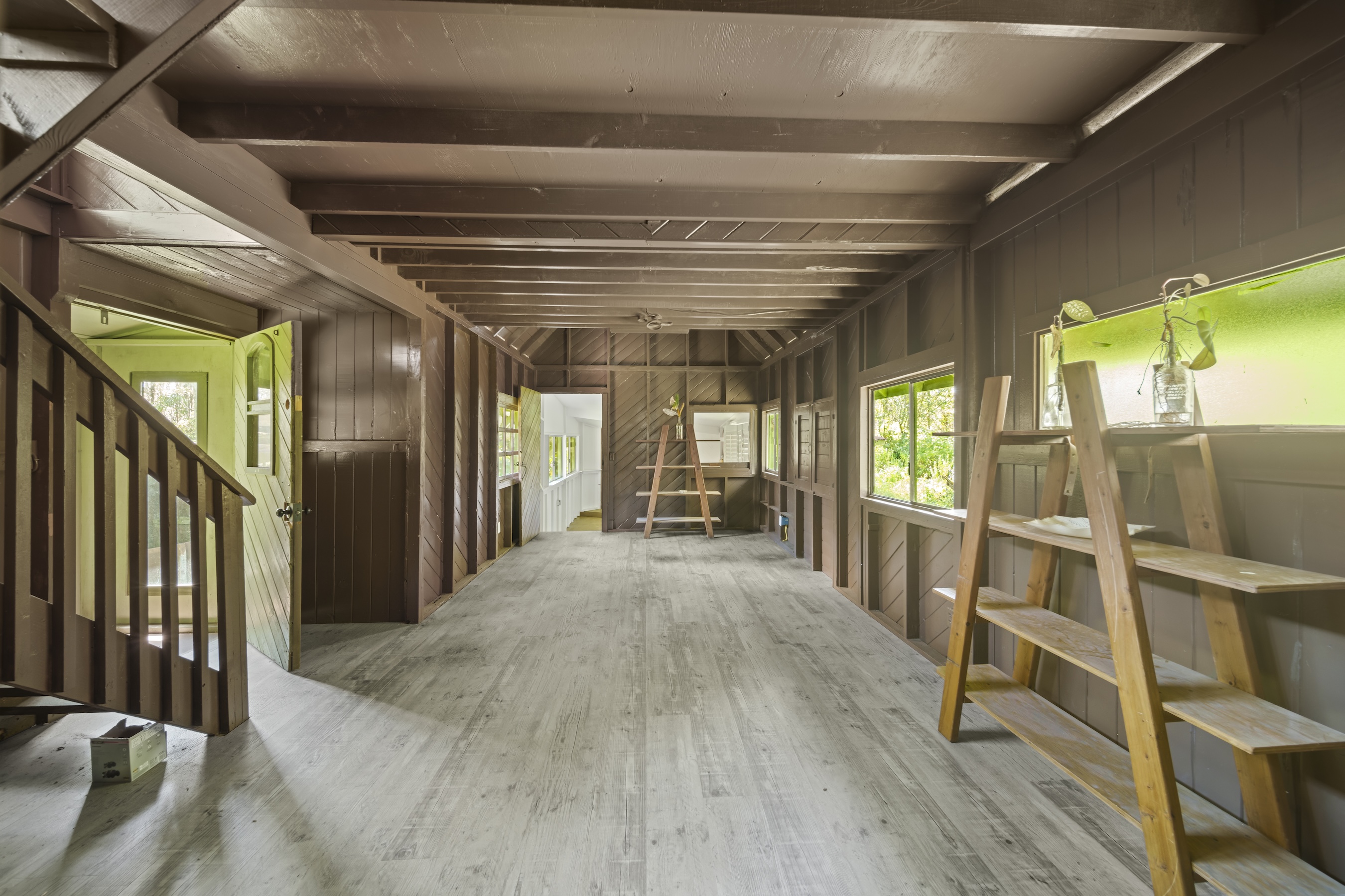 16-1857 Hopue Road Mountain View, HI 96771 - Photo 16 of 30 a view of a hallway with wooden floor and staircase